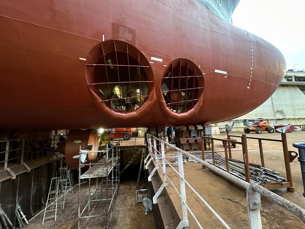 Vessel hull and tunnel thrusters in dry dock.